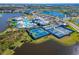 Aerial view of community tennis courts and pool area at 8705 Coastal Key Way, Parrish, FL 34219