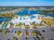 Aerial view of community clubhouse and pool area with parking at 8705 Coastal Key Way, Parrish, FL 34219