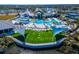 Community pool with a large grassy area for recreation at 8705 Coastal Key Way, Parrish, FL 34219