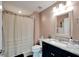 Clean bathroom with shower/tub combo, granite countertop, and updated vanity at 8705 Coastal Key Way, Parrish, FL 34219