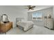 Charming bedroom with a double bed, dresser and large window at 8705 Coastal Key Way, Parrish, FL 34219