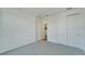 Spacious bedroom with double doors leading to another room at 8705 Coastal Key Way, Parrish, FL 34219