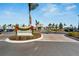 Inviting clubhouse entrance with landscaping and signage at 8705 Coastal Key Way, Parrish, FL 34219