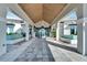 Grand clubhouse entrance with tiled floor and water features at 8705 Coastal Key Way, Parrish, FL 34219