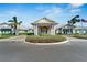 Elegant clubhouse with covered entryway and landscaping at 8705 Coastal Key Way, Parrish, FL 34219