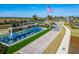 Welcoming community entrance with a water feature and flag at 8705 Coastal Key Way, Parrish, FL 34219