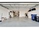 Spacious two-car garage with overhead storage and extra space at 8705 Coastal Key Way, Parrish, FL 34219