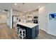 Modern kitchen featuring a large island and stainless steel appliances at 8705 Coastal Key Way, Parrish, FL 34219