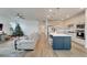 Open concept kitchen with island, stainless steel appliances, and white cabinets at 8705 Coastal Key Way, Parrish, FL 34219