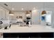 Kitchen island with breakfast bar, looking toward living and dining area at 8705 Coastal Key Way, Parrish, FL 34219