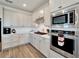 Well-equipped kitchen with stainless steel appliances and ample cabinet space at 8705 Coastal Key Way, Parrish, FL 34219