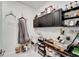 Laundry room with cabinets, sink, and built-in shelving at 8705 Coastal Key Way, Parrish, FL 34219