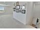 Loft area with wall decor and access to another room at 8705 Coastal Key Way, Parrish, FL 34219