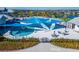Expansive pool area with shade structures and lounge chairs at 8705 Coastal Key Way, Parrish, FL 34219