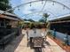 Outdoor patio with dining area and string lights at 8726 N Orange Pl, Tampa, FL 33617