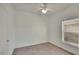 Bright bedroom featuring neutral walls, carpet flooring, and a window at 9622 Cypress Harbor Dr, Gibsonton, FL 33534