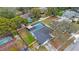 House with a pool, gray exterior, and a large backyard at 1009 Black Knight Dr, Valrico, FL 33594