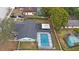 Aerial view of a house with a pool and fenced backyard in a residential neighborhood at 1009 Black Knight Dr, Valrico, FL 33594