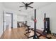 Bright workout area featuring wood floors, a ceiling fan and closet at 1009 Black Knight Dr, Valrico, FL 33594