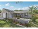 This property has a well-kept front yard with shrubs, rocks, and low lying ground cover at 1009 Black Knight Dr, Valrico, FL 33594