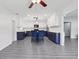 Spacious open kitchen design with two-tone cabinets and breakfast bar seating at 1009 Black Knight Dr, Valrico, FL 33594