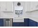 Updated kitchen featuring a farmhouse sink, white cabinets, subway tile backsplash, and stainless steel appliances at 1009 Black Knight Dr, Valrico, FL 33594