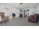 Open-concept living space with a view to a kitchen with breakfast bar seating at 1009 Black Knight Dr, Valrico, FL 33594