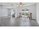 Large windows flood this living room with bright natural light and modern floors at 1009 Black Knight Dr, Valrico, FL 33594