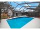 Relaxing screened pool and backyard access at 1009 Black Knight Dr, Valrico, FL 33594