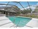 Inviting in-ground pool with screened enclosure offering a private backyard oasis at 1009 Black Knight Dr, Valrico, FL 33594