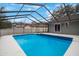 Refreshing screened pool with backyard view at 1009 Black Knight Dr, Valrico, FL 33594