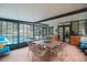 Sunroom with pool view and dining furniture at 1009 Black Knight Dr, Valrico, FL 33594