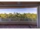 Private balcony view surrounded by lush greenery and clear skies at 12077 Gandy N Blvd # 332, St Petersburg, FL 33702