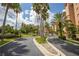 Gated community entrance with palm trees and landscaping at 12077 Gandy N Blvd # 332, St Petersburg, FL 33702