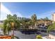 Beautiful exterior view of community landscaping, a pond, fountain and palm trees on a sunny day at 12077 Gandy N Blvd # 332, St Petersburg, FL 33702