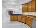 Open kitchen with a granite countertop island, stainless steel appliances, and ample storage at 12077 Gandy N Blvd # 332, St Petersburg, FL 33702