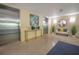 Condo lobby with stainless steel elevators, modern console table, and comfortable seating at 12077 Gandy N Blvd # 332, St Petersburg, FL 33702