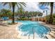 Relaxing community pool with lounge chairs at 12077 Gandy N Blvd # 332, St Petersburg, FL 33702