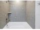 Tile shower and tub combination with modern fixtures at 12077 Gandy N Blvd # 332, St Petersburg, FL 33702