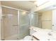 Bathroom with shower, toilet, and vanity with a mirror at 12119 Sunny Glen Ln # F1, Hudson, FL 34669