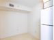 Small dining area with tile floor and an empty wall at 12119 Sunny Glen Ln # F1, Hudson, FL 34669