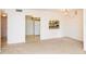 Dining area with kitchen pass-through and light-colored carpet at 12119 Sunny Glen Ln # F1, Hudson, FL 34669