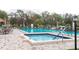 Relaxing community spa adjacent to the refreshing swimming pool at 12119 Sunny Glen Ln # F1, Hudson, FL 34669