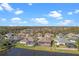 Community overview, showing lake, homes, and landscape at 1406 Deerbourne Dr, Wesley Chapel, FL 33543