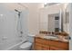 Clean bathroom featuring a bathtub, shower, and granite-topped vanity at 1406 Deerbourne Dr, Wesley Chapel, FL 33543