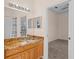 Bathroom with granite countertop vanity and access to backyard at 1406 Deerbourne Dr, Wesley Chapel, FL 33543