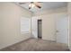 Spacious bedroom with neutral walls, ceiling fan, and ample closet space at 1406 Deerbourne Dr, Wesley Chapel, FL 33543