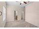 Carpeted bedroom with dual closets and attached bathroom at 1406 Deerbourne Dr, Wesley Chapel, FL 33543