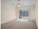 Large bedroom with sliding glass doors leading to the screened-in lanai at 1406 Deerbourne Dr, Wesley Chapel, FL 33543