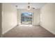 Spacious bedroom with sliding glass doors and pond view at 1406 Deerbourne Dr, Wesley Chapel, FL 33543